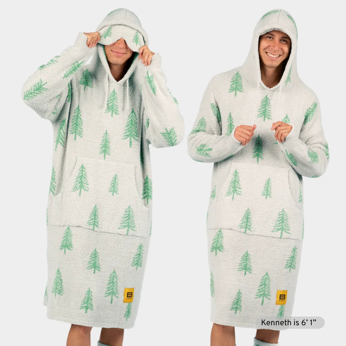 Cream Premier Plush hoodie blanket with green pine tree pattern, shown front and back worn by model with hood up and down