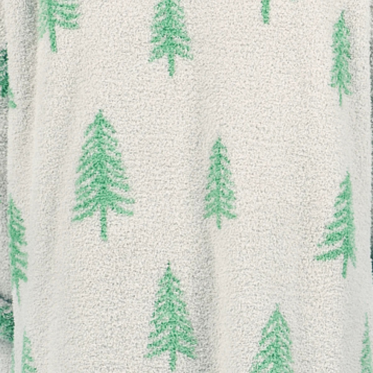 Cream oversized blanket with green pine tree pattern throughout