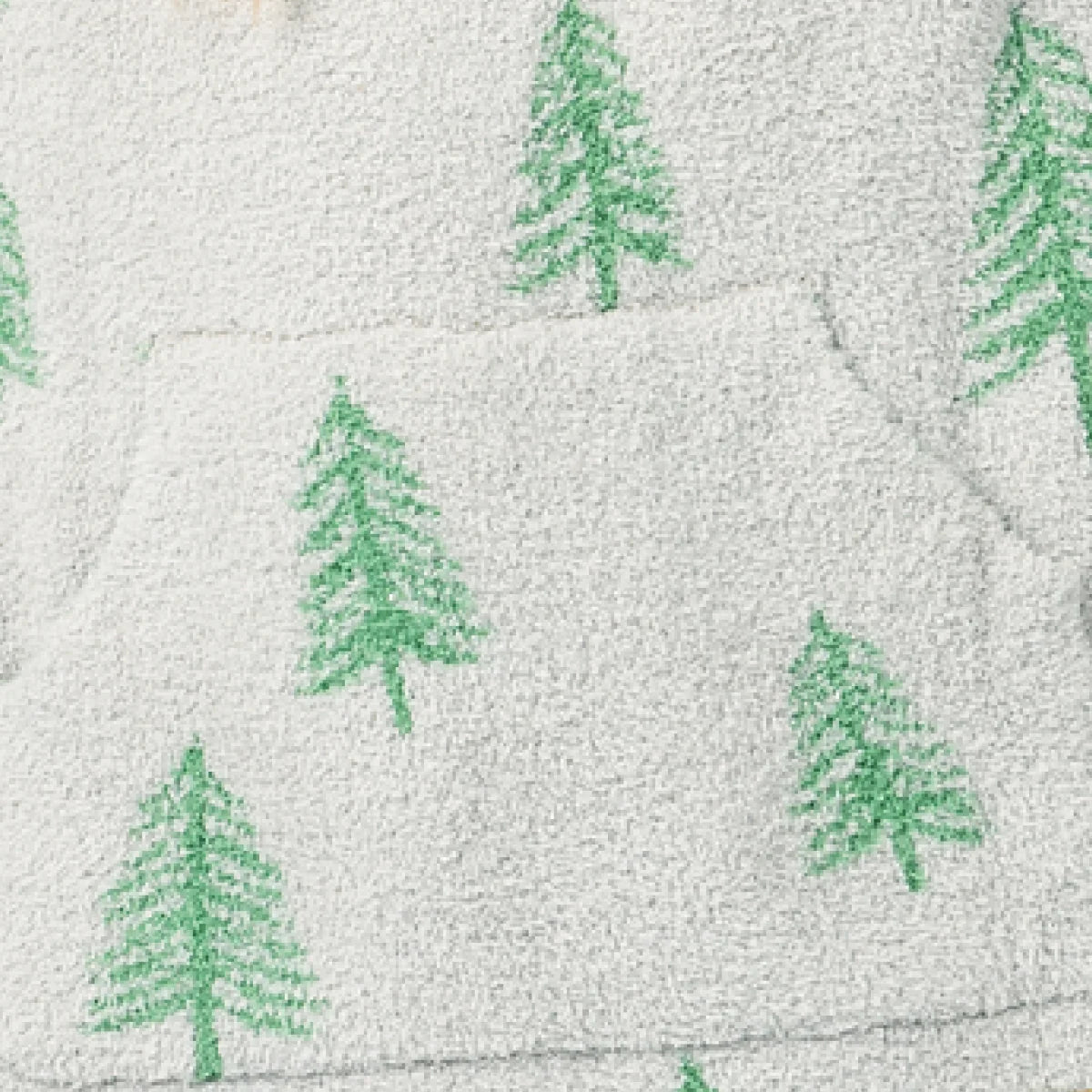 Cream Premier Plush blanket with green pine tree pattern, soft textured fabric