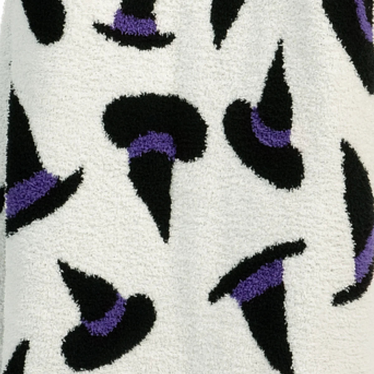 Cream oversized blanket with black and purple abstract witchy pattern featuring curved shapes and playful design
