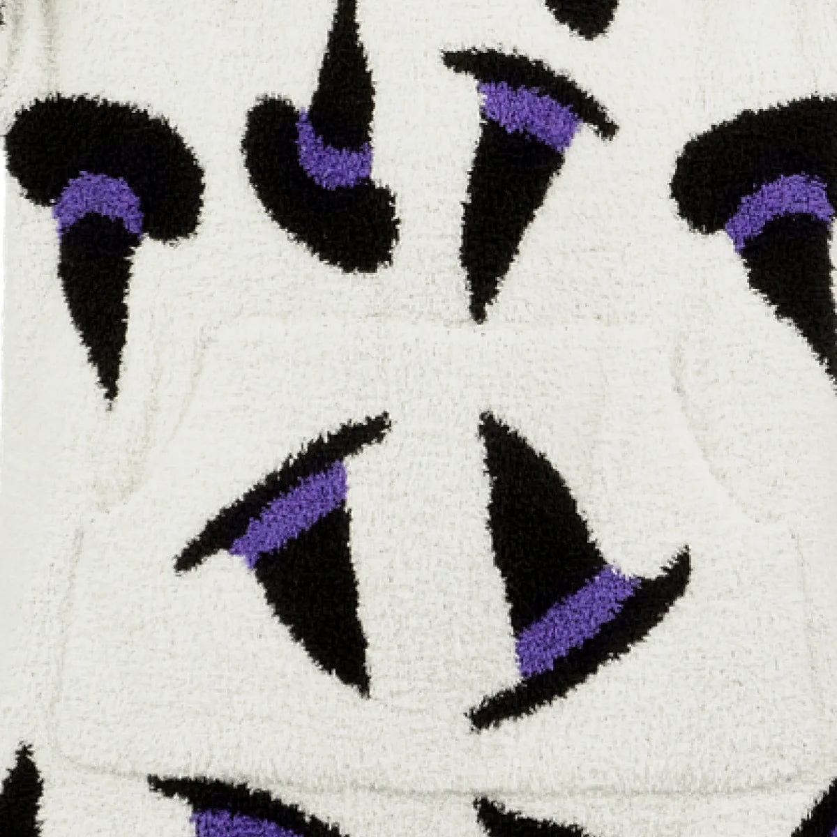 Cream oversized blanket with black and purple abstract witchy pattern, soft plush texture