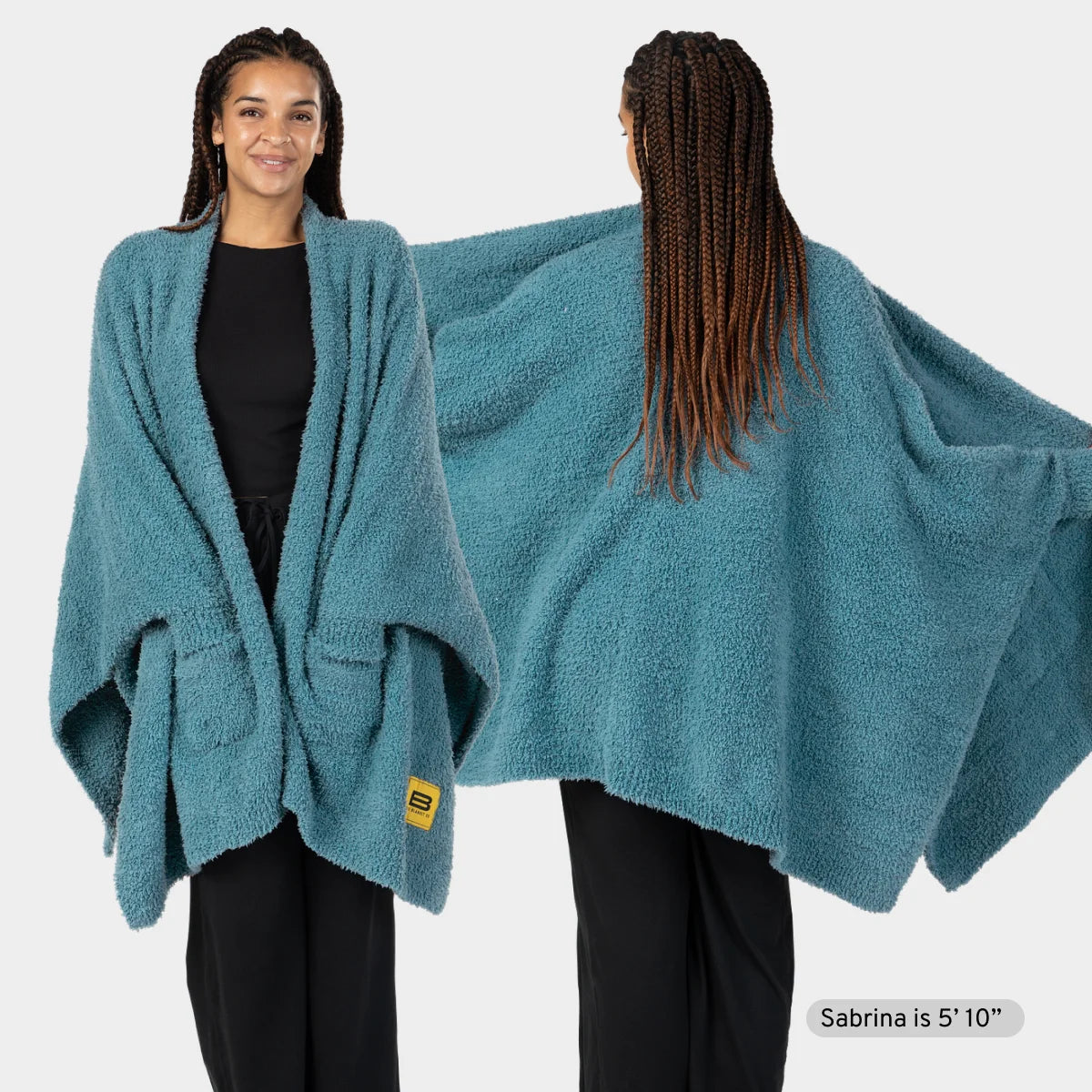 Woman wearing oversized teal plush wrap blanket draped over shoulders, shown from front and back views
