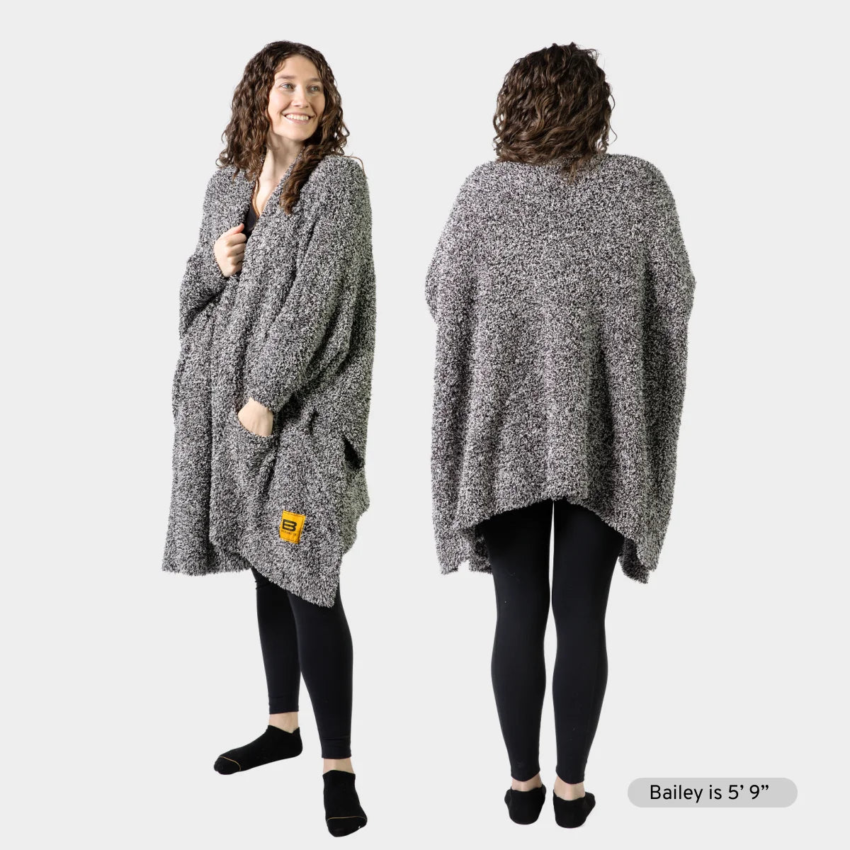 Gray heather Premier Plush wrap draped on woman shown front and back, demonstrating oversized fit and pocket detail
