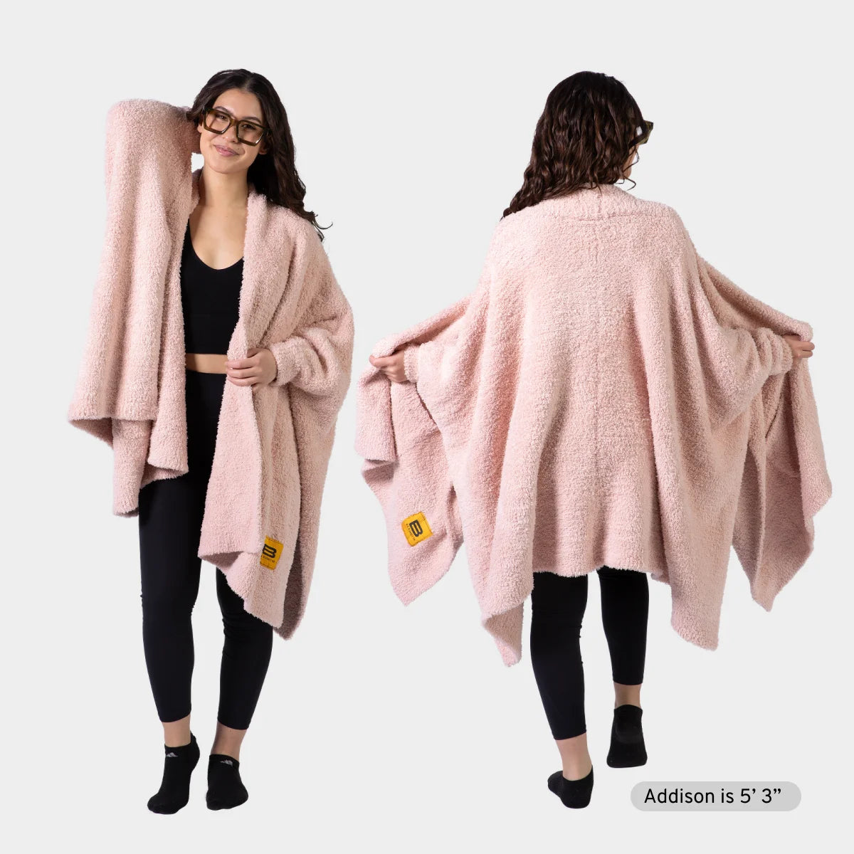 Woman wearing blush pink oversized Premier Plush Wrap, shown front and back views with draped styling
