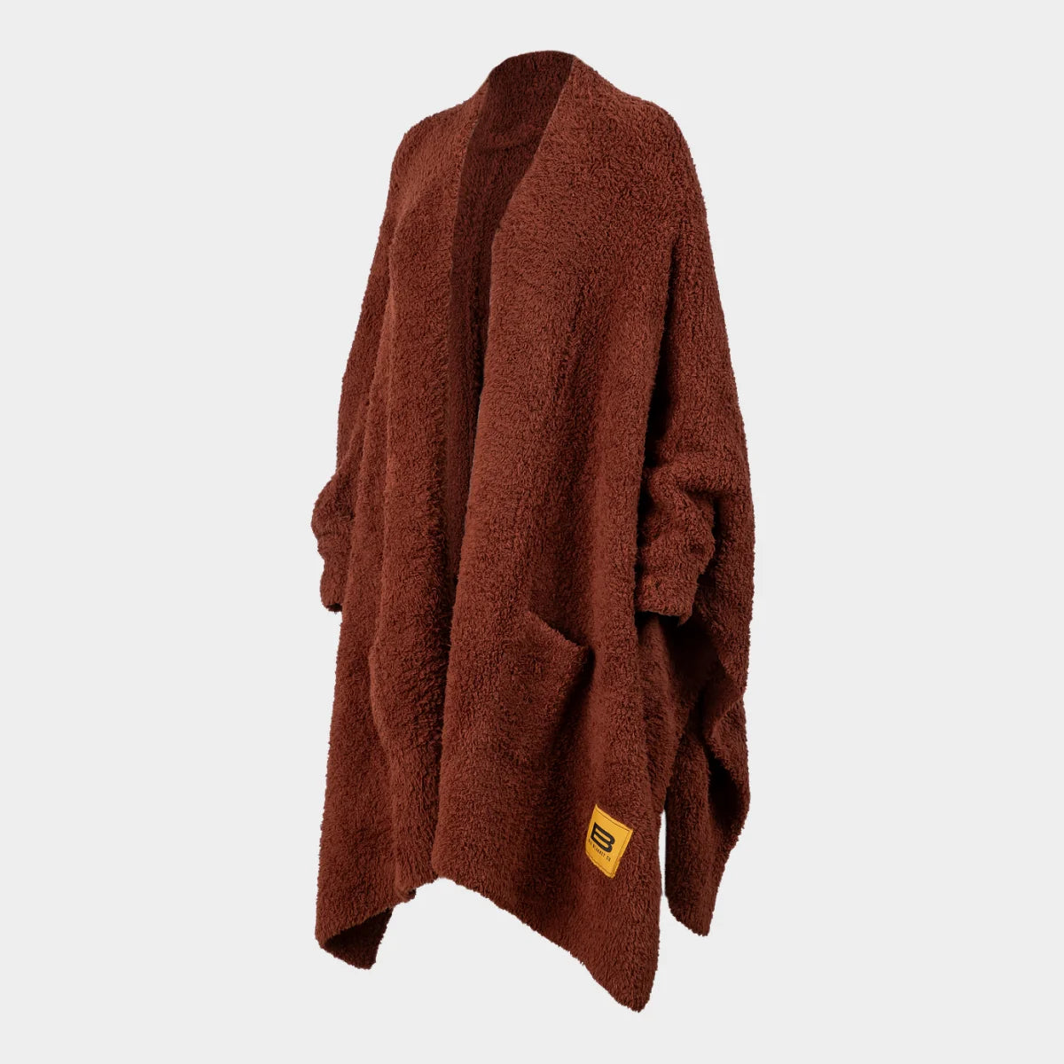 Chocolate Premier Plush oversized wrap blanket draped open, showing soft textured fabric and yellow brand label