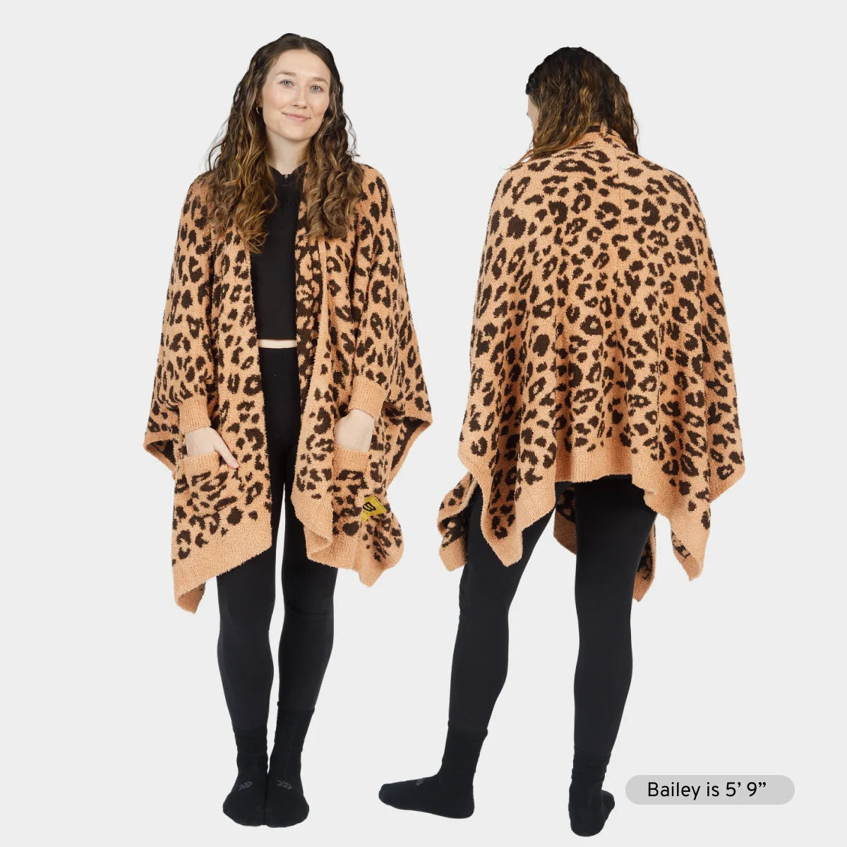 Leopard print oversized blanket wrap worn as shawl over black clothing, front and back view