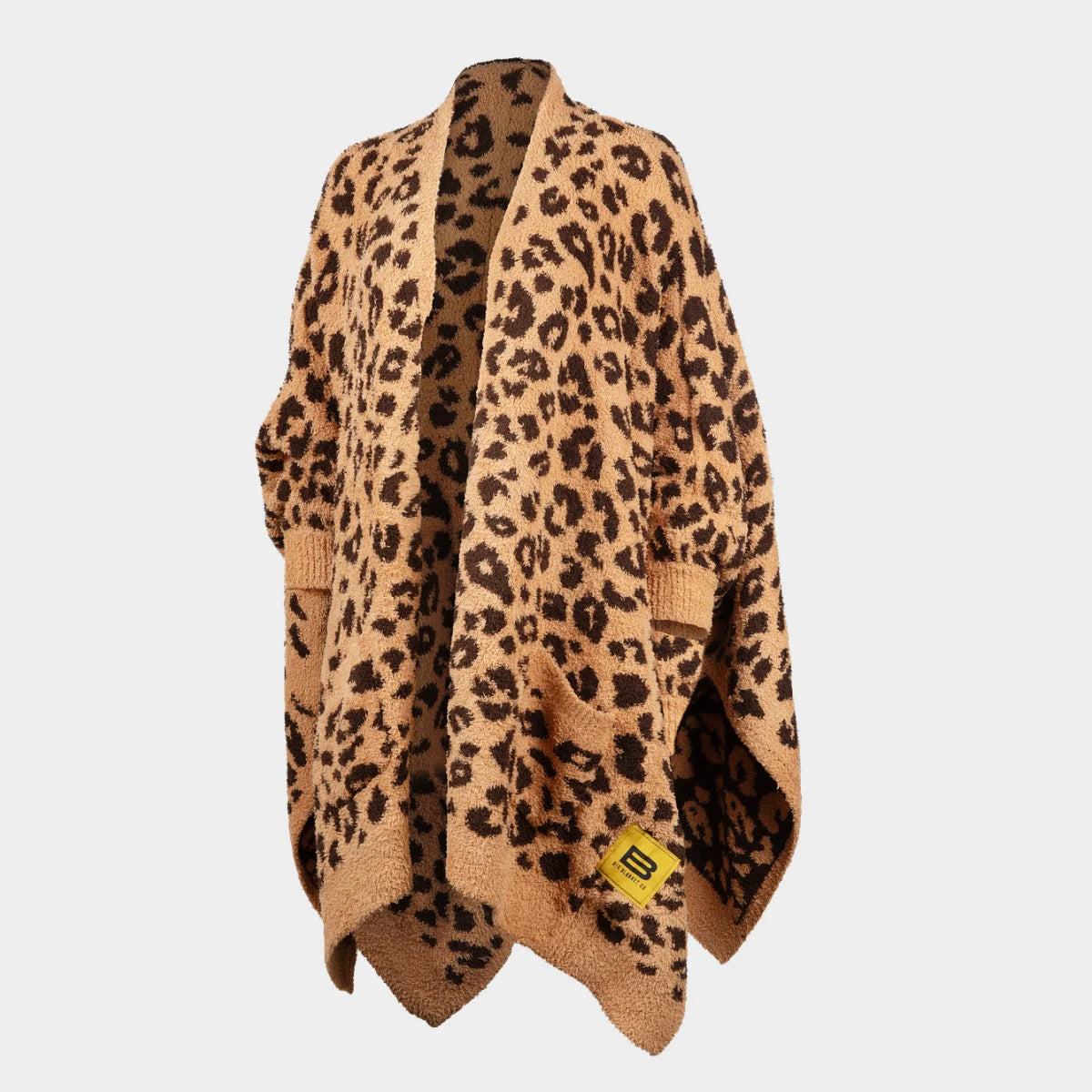 Oversized leopard print blanket wrap in tan and brown with scalloped edges and Big Blanket Co logo tag