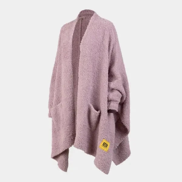 Mauve oversized knit wrap with open front and asymmetrical hem, displayed on dress form with Big Blanket Co label visible