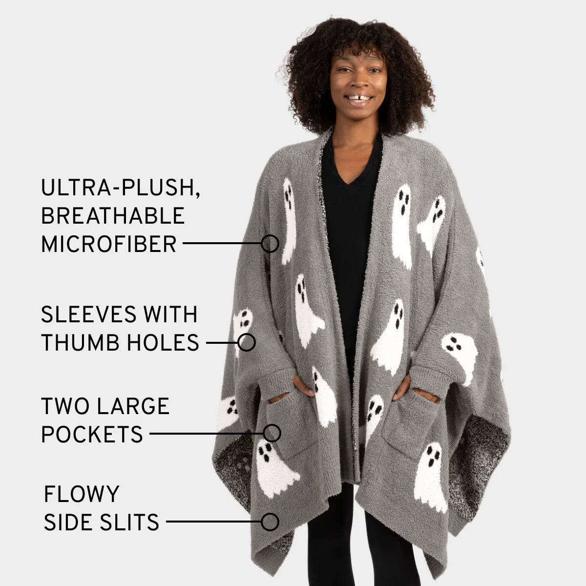 Woman wearing gray Premier Plush Wrap with white ghost pattern, thumb holes, pockets, and side slits