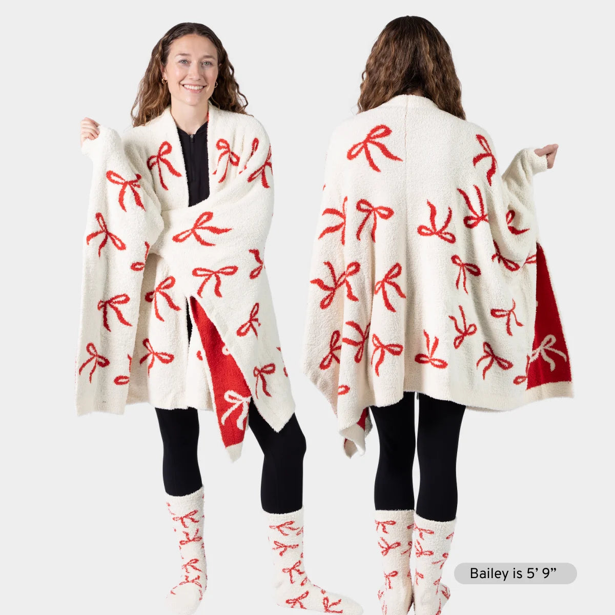 Cream oversized wrap with red bow pattern, draped on woman shown front and back, paired with matching socks