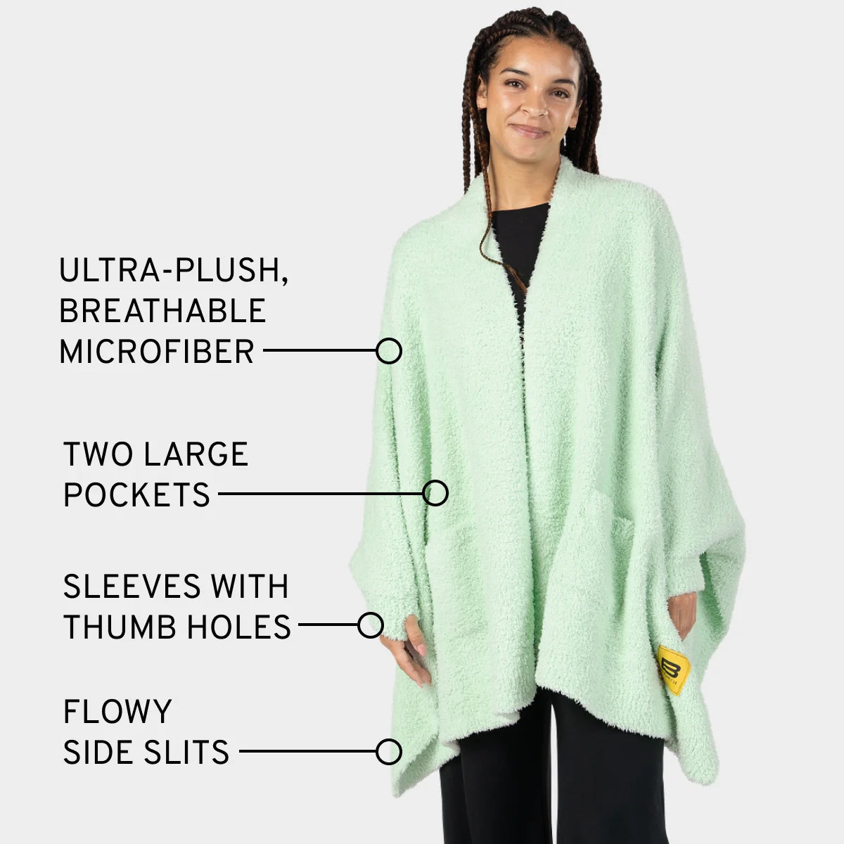 Mint Premier Plush Wrap with thumb hole sleeves, pockets, and side slits worn by woman