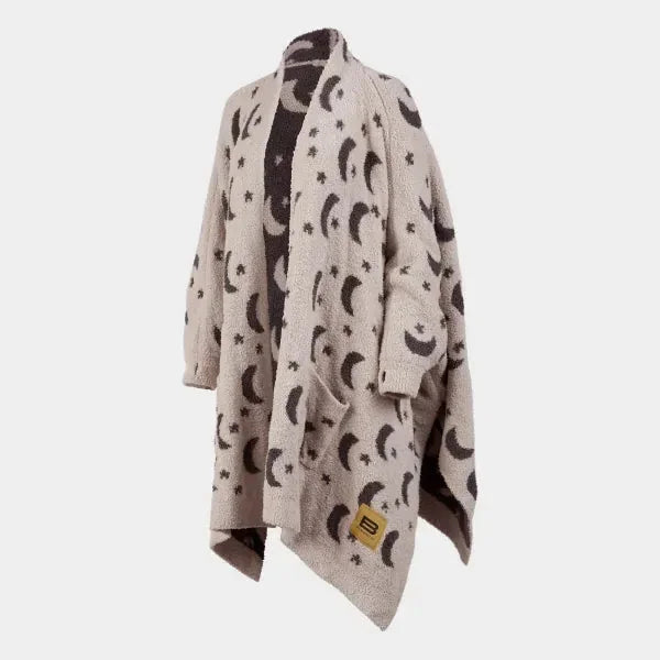 Cream Premier Plush Wrap with moon and star pattern draped on form