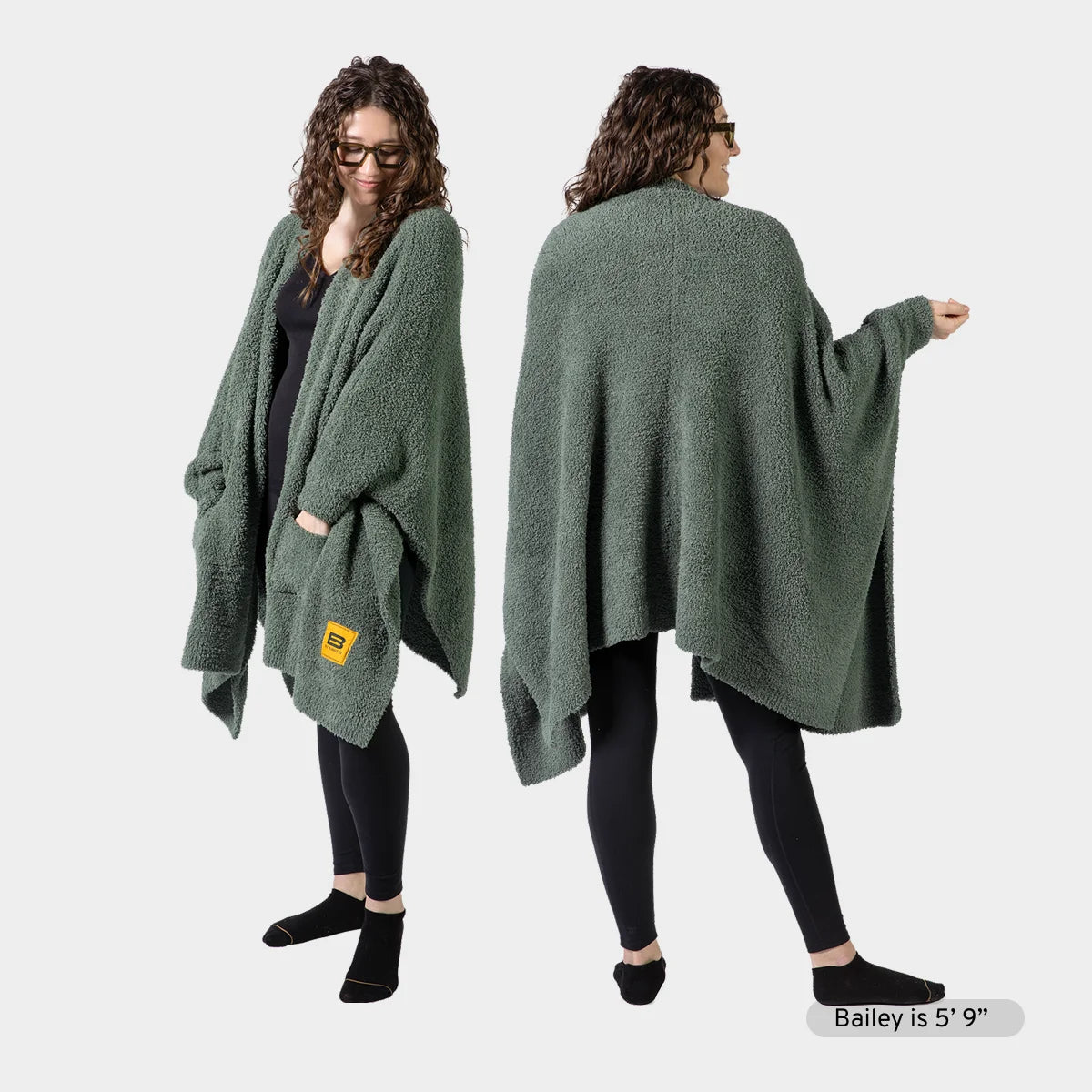 Woman wearing sage green oversized blanket wrap with front pockets, shown from front and back views