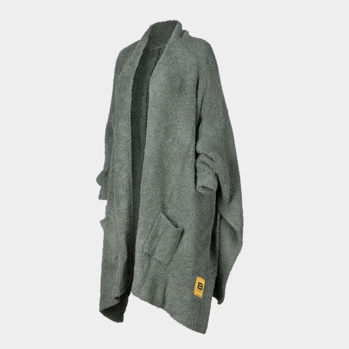 Sage green textured oversized blanket wrap with draped sleeves and yellow brand label