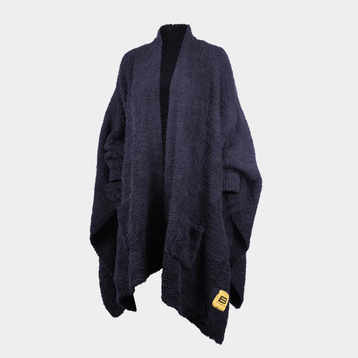 Oversized dark navy textured blanket wrap with asymmetrical draping and yellow brand label tag