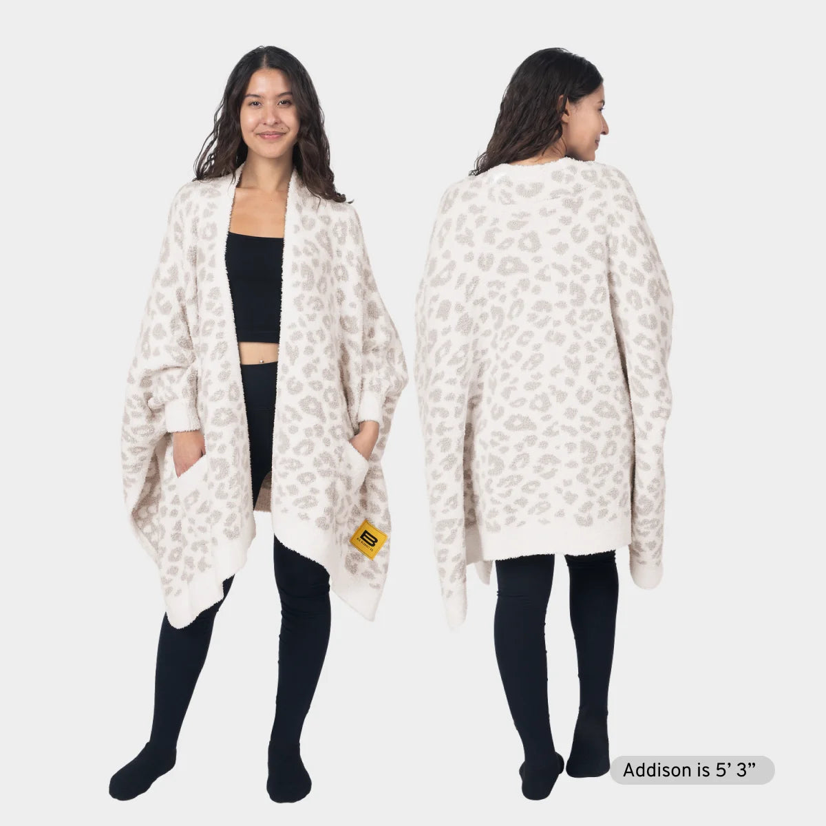 Cream and gray snow leopard print oversized wrap cardigan worn open over black top, shown front and back on model