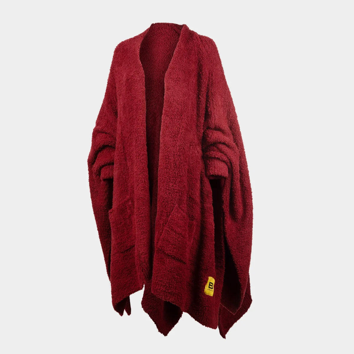 Deep wine oversized wrap blanket with open front and raw edges, displayed on dress form